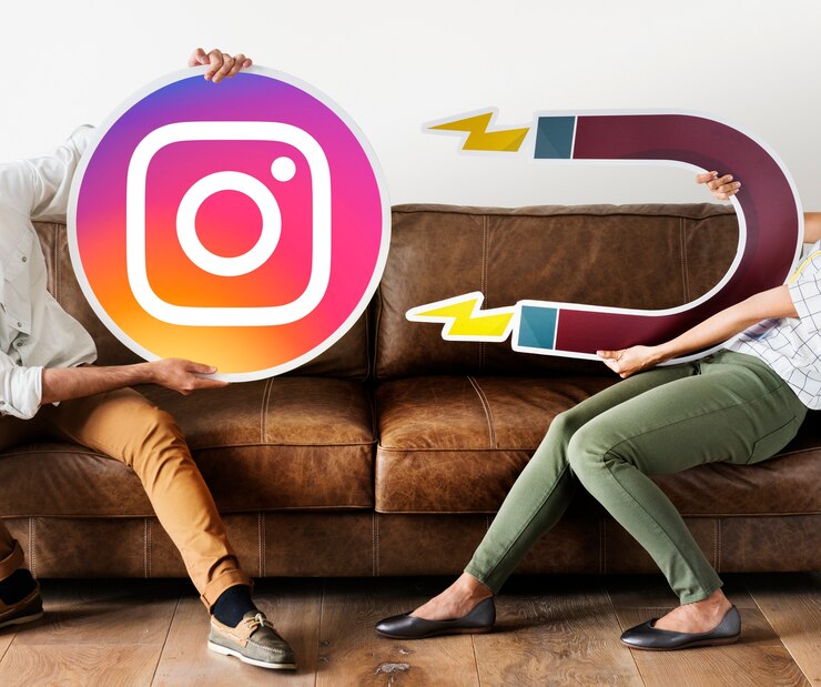 a man and a woman are holding two signs: one with an Instagram icon and the other with a magnet